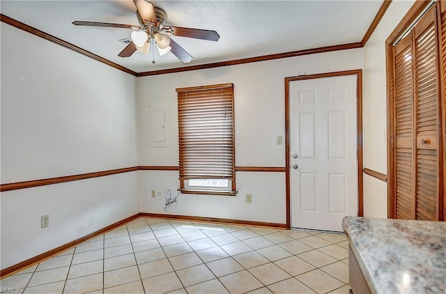 entryway with baseboards, ornamental molding, light tile patterned floors, and ceiling fan