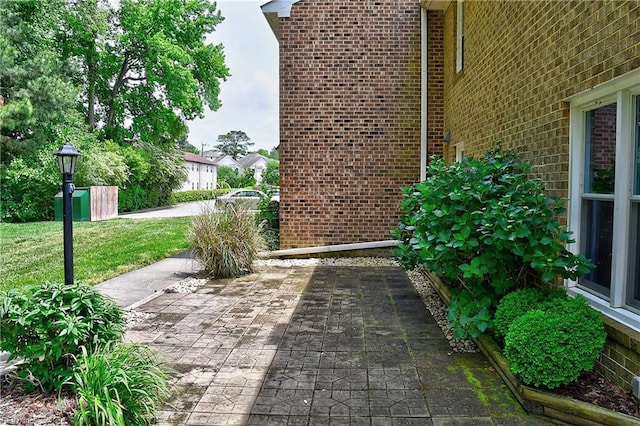exterior space featuring brick siding
