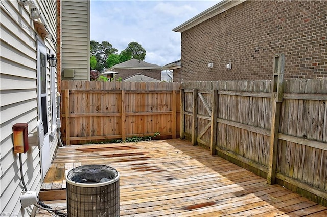 deck with central AC unit and fence