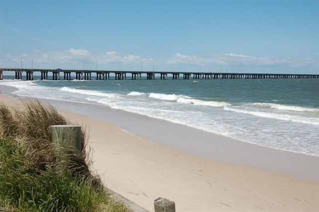 water view with a view of the beach and a pier