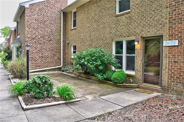 view of side of property with brick siding