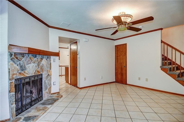 unfurnished living room featuring a fireplace, crown molding, stairway, baseboards, and ceiling fan