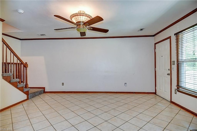 unfurnished room featuring crown molding, visible vents, a ceiling fan, and stairs