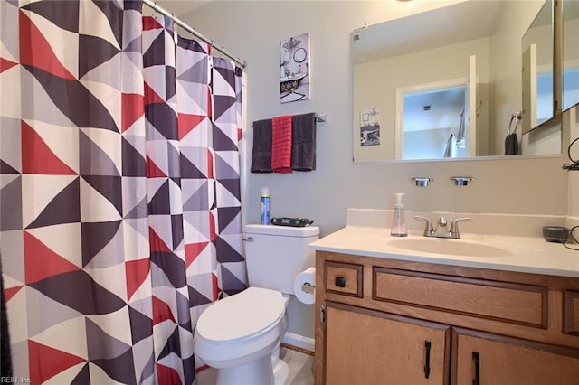 bathroom with toilet, a shower with shower curtain, and vanity