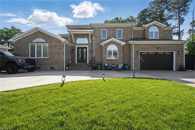 traditional-style house with concrete driveway, a front yard, brick siding, and an attached garage