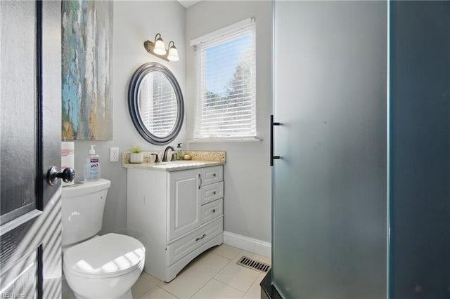 bathroom with toilet, baseboards, visible vents, tile patterned flooring, and vanity