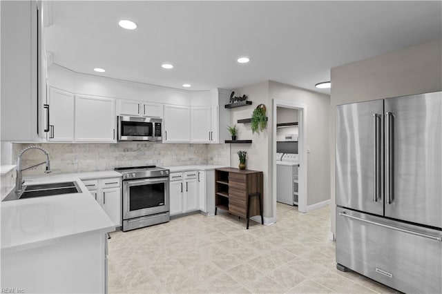 390 Naval Base Rd, Norfolk, VA 23505 - kitchen with a sink, stainless steel appliances, open shelves, washing machine and clothes dryer, and light countertops