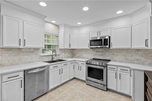 390 Naval Base Rd, Norfolk, VA 23505 - kitchen featuring light countertops, white cabinetry, stainless steel appliances, and a sink