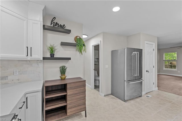 390 Naval Base Rd, Norfolk, VA 23505 - kitchen with high quality fridge, open shelves, white cabinets, light countertops, and decorative backsplash