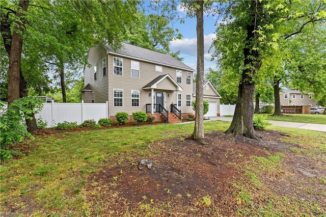 390 Naval Base Rd, Norfolk, VA 23505 - colonial home with an attached garage, driveway, fence, and a front lawn