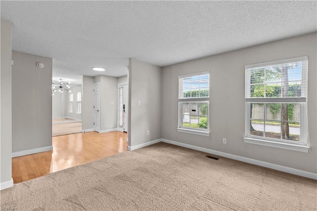 390 Naval Base Rd, Norfolk, VA 23505 - carpeted empty room with a textured ceiling, visible vents, and baseboards