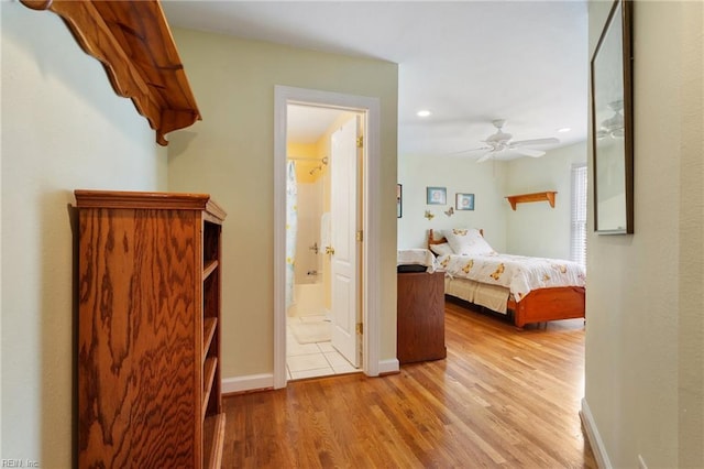 bedroom with wood finished floors, baseboards, ceiling fan, ensuite bath, and recessed lighting