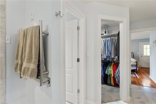 interior space featuring marble finish floor and baseboards