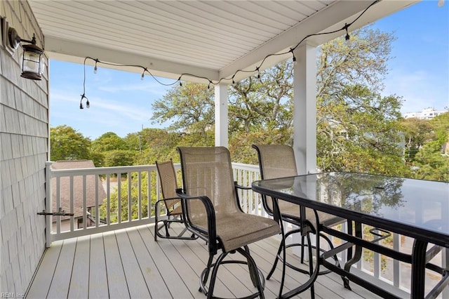 wooden deck featuring outdoor dining space