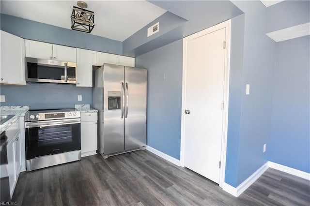 kitchen featuring baseboards, visible vents, white cabinetry, dark wood-type flooring, and stainless steel appliances