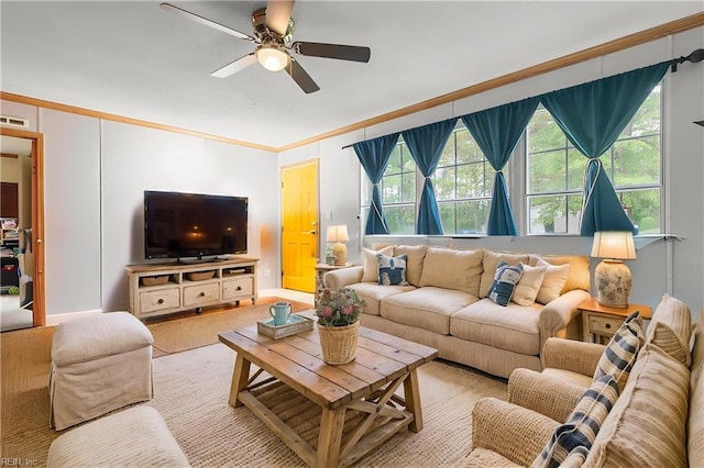 living room featuring crown molding and ceiling fan