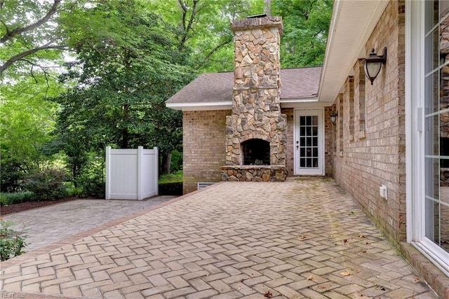 view of patio / terrace with an outdoor stone fireplace