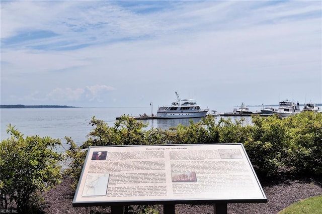 surrounding community with a water view