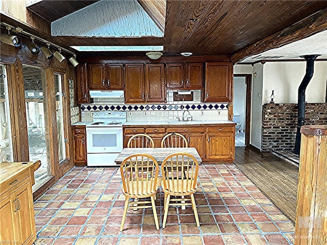 3810 Seaford Rd, Seaford, VA 23696 - kitchen with backsplash, wood ceiling, electric stove, and under cabinet range hood