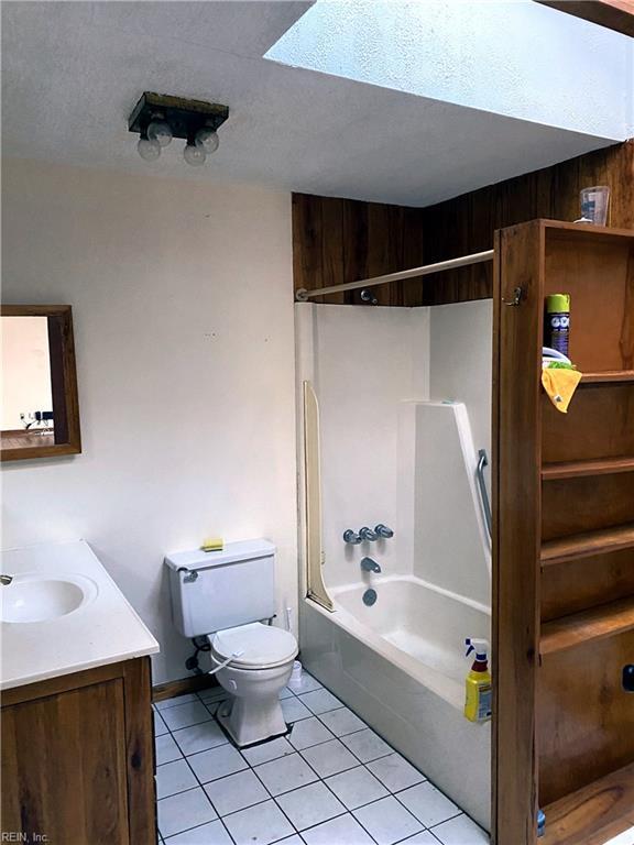 3810 Seaford Rd, Seaford, VA 23696 - full bath with toilet, bathing tub / shower combination, tile patterned flooring, and vanity