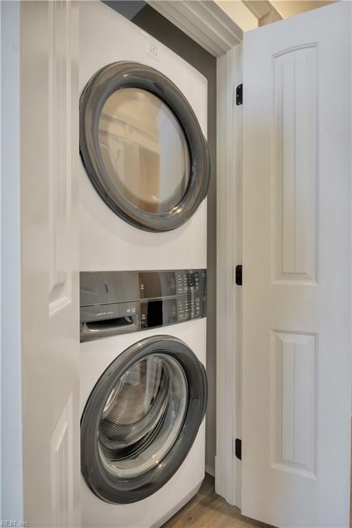102 Blue Crab Pt, Poquoson, VA 23662 - washroom with laundry area, stacked washer / drying machine, and wood finished floors