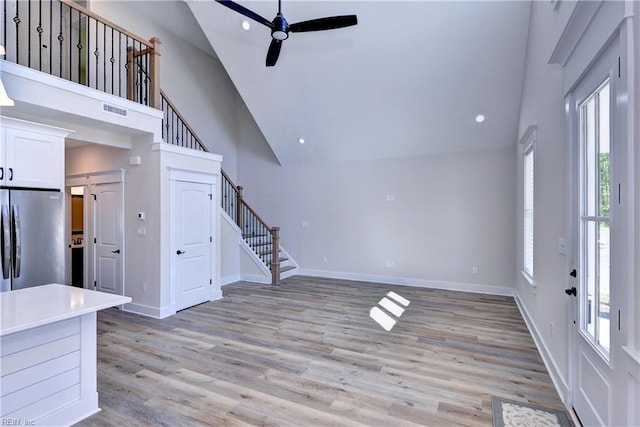 102 Blue Crab Pt, Poquoson, VA 23662 - unfurnished living room featuring stairway, a wealth of natural light, high vaulted ceiling, and a ceiling fan