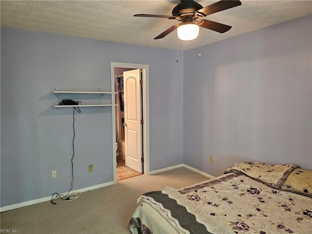 bedroom with carpet floors, baseboards, and a ceiling fan