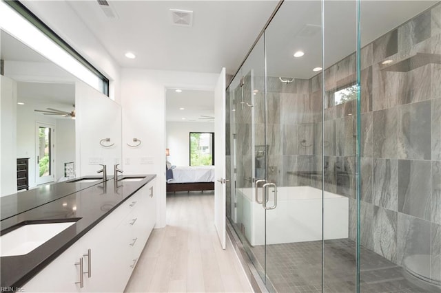 bathroom featuring a sink, double vanity, connected bathroom, and visible vents