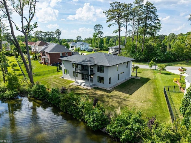 birds eye view of property featuring a water view and a residential view