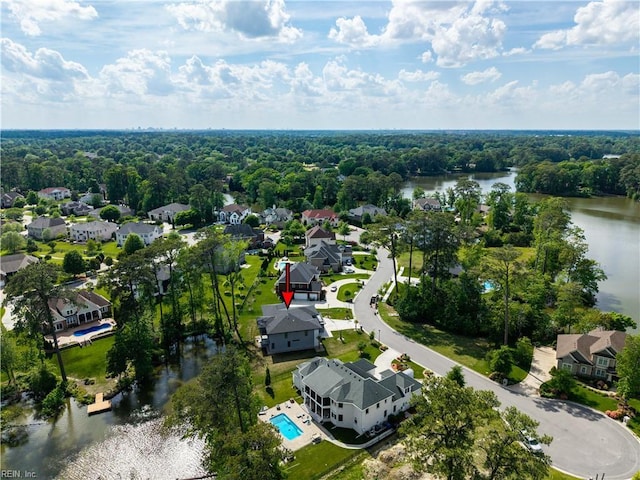 birds eye view of property featuring a water view and a residential view