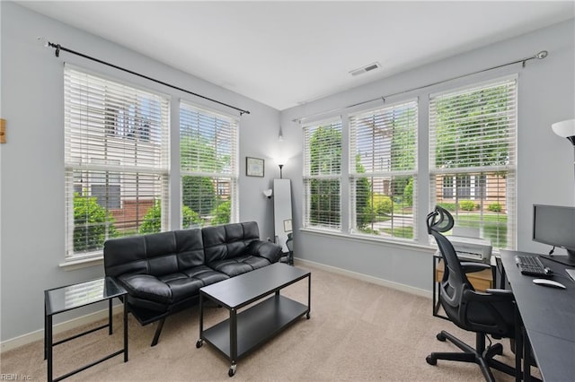 carpeted office featuring baseboards