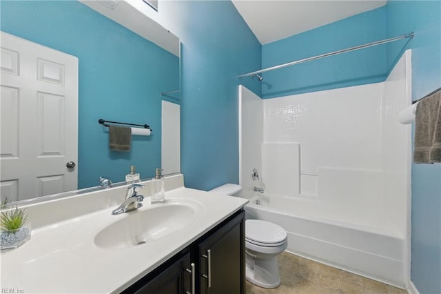 bathroom with toilet, vanity, and washtub / shower combination