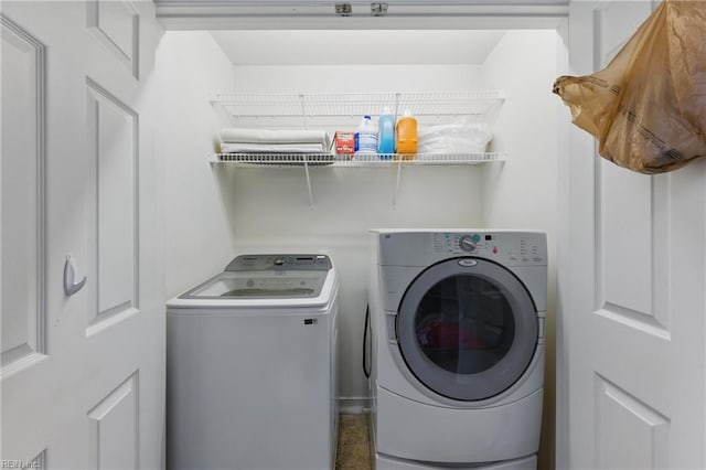 laundry area with washing machine and clothes dryer