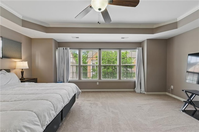 carpeted bedroom with ornamental molding, baseboards, and a ceiling fan