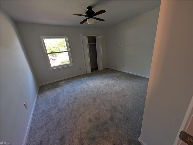 unfurnished bedroom with a closet, baseboards, ceiling fan, and carpet floors