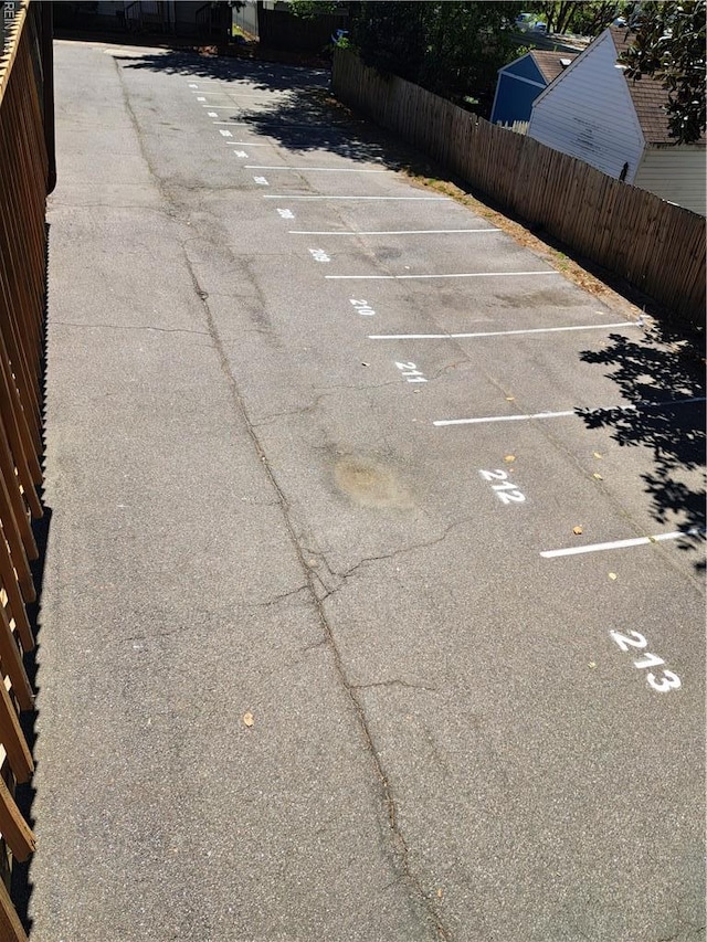 uncovered parking lot with fence