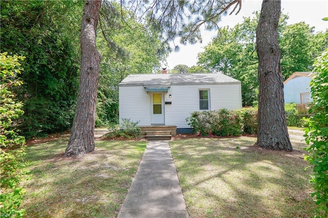 48 Pollux Cir W, Portsmouth, VA 23701 - bungalow featuring a front lawn and a chimney