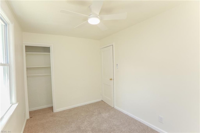 48 Pollux Cir W, Portsmouth, VA 23701 - unfurnished bedroom with multiple windows, light carpet, baseboards, and a closet