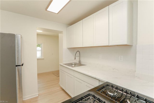48 Pollux Cir W, Portsmouth, VA 23701 - kitchen with a sink, stainless steel appliances, tasteful backsplash, and white cabinets