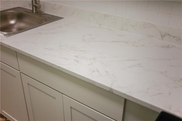 48 Pollux Cir W, Portsmouth, VA 23701 - interior details with a sink and light stone countertops