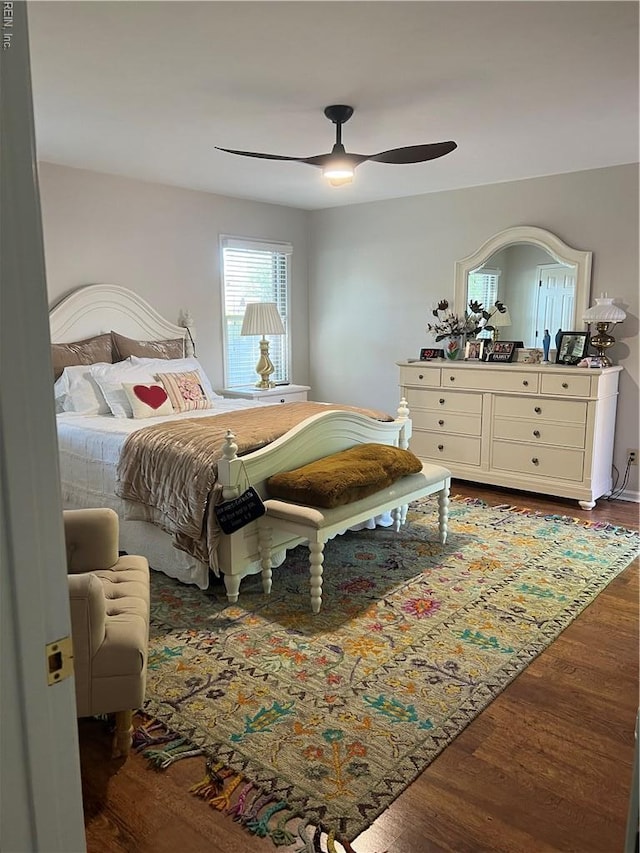 bedroom featuring wood finished floors and ceiling fan