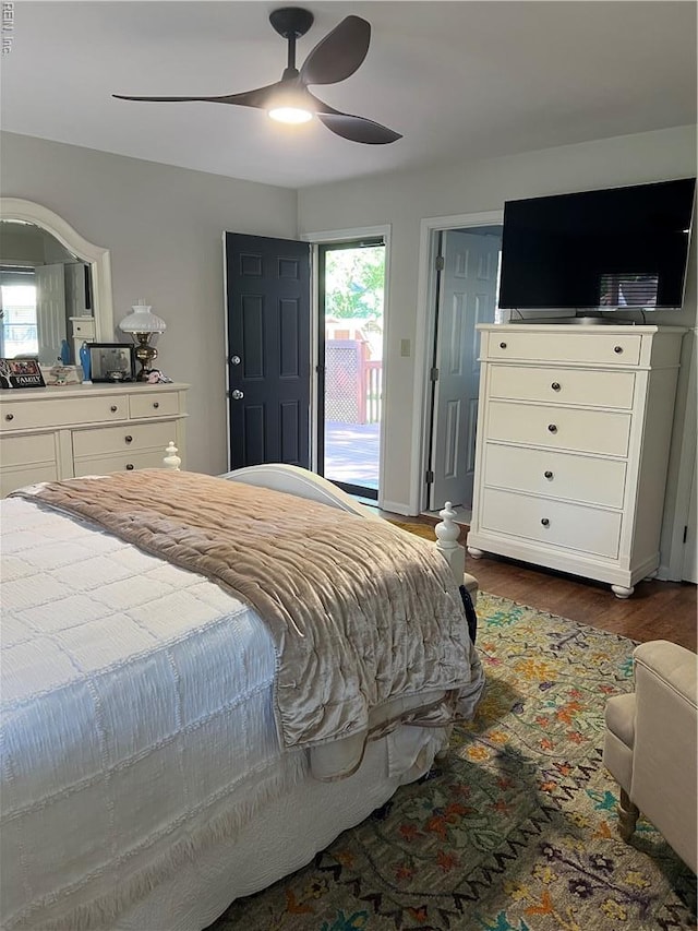 bedroom featuring wood finished floors, ceiling fan, and access to exterior