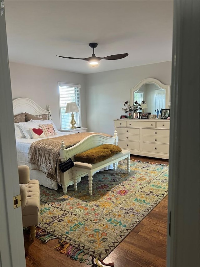 bedroom featuring a ceiling fan and wood finished floors