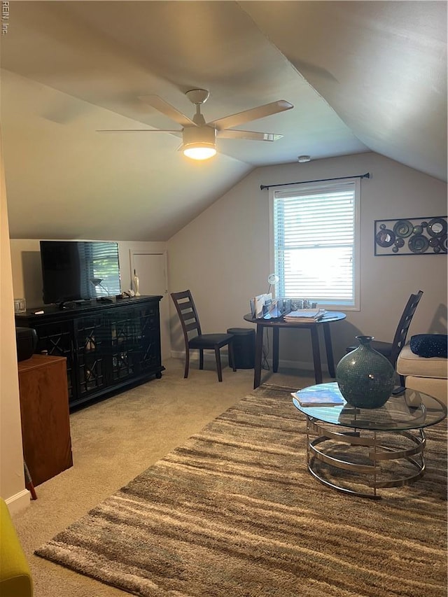interior space with carpet, vaulted ceiling, and a ceiling fan