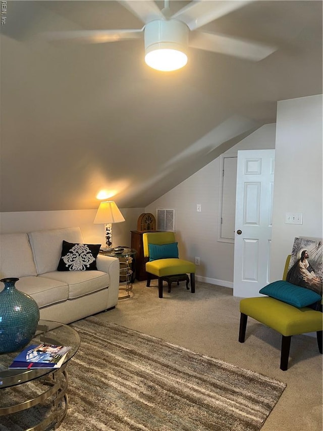 living room featuring vaulted ceiling, visible vents, and carpet floors
