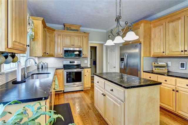kitchen with appliances with stainless steel finishes, a sink, light wood-type flooring, ornamental molding, and light brown cabinetry
