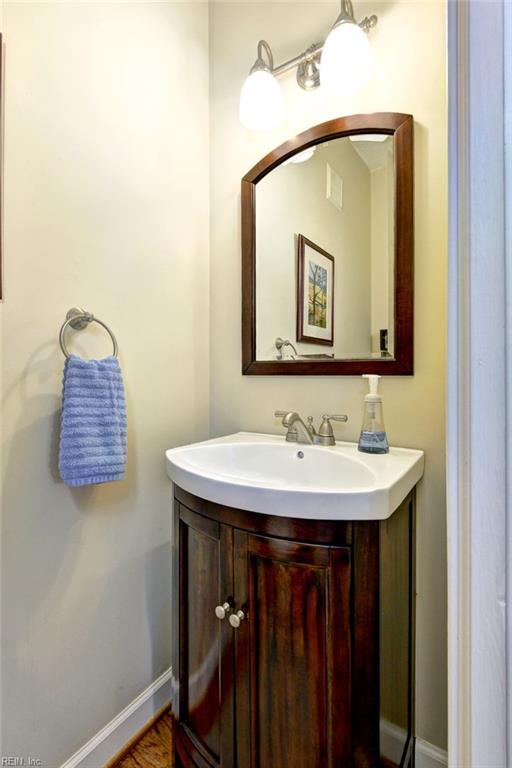 bathroom with baseboards and vanity
