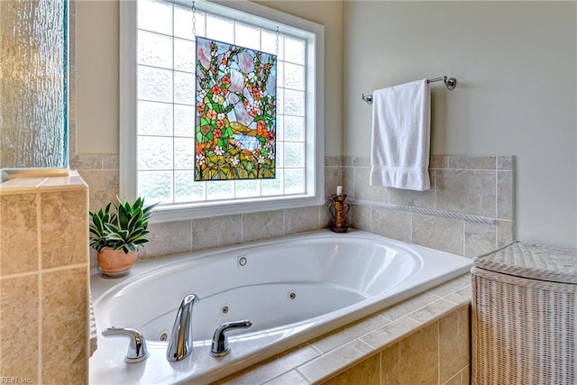 full bathroom featuring a whirlpool tub
