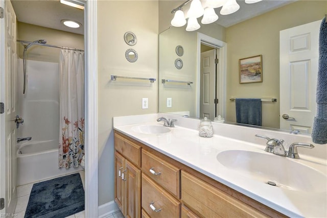 bathroom featuring tile patterned flooring, shower / tub combo with curtain, and double vanity