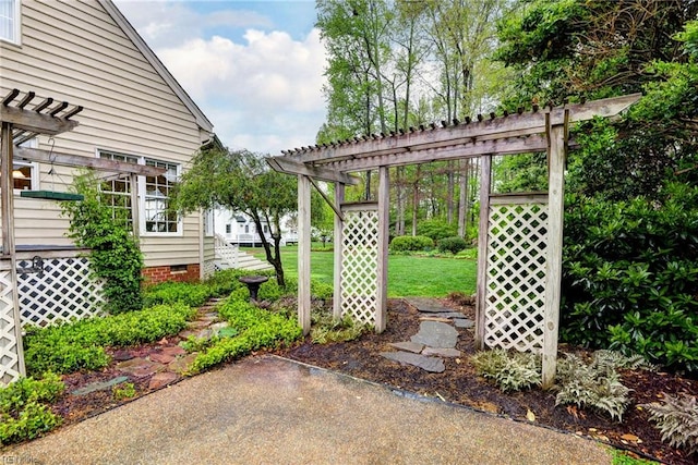 view of green lawn with a pergola